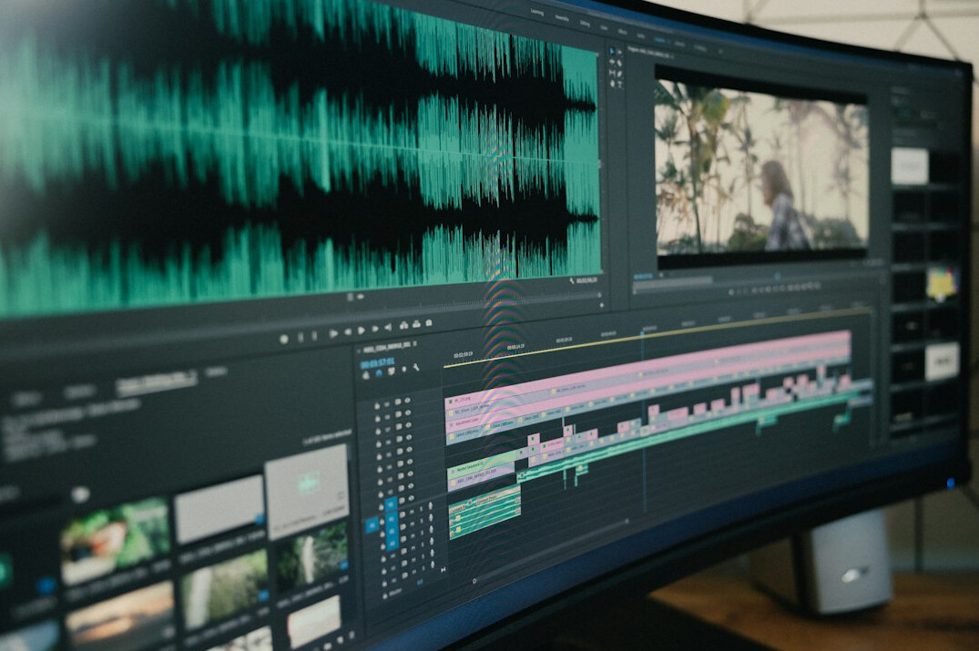 filmmaker editing video on computer