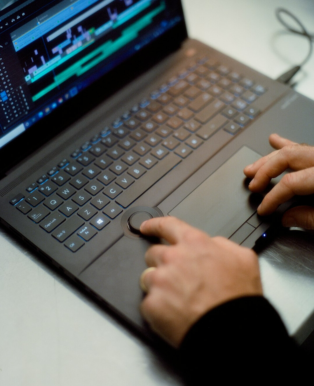 film editor working on computer