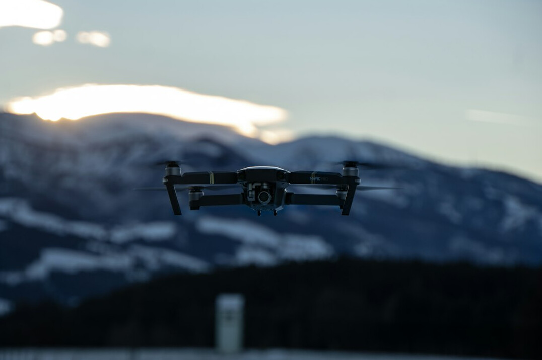 drone flying over mountains