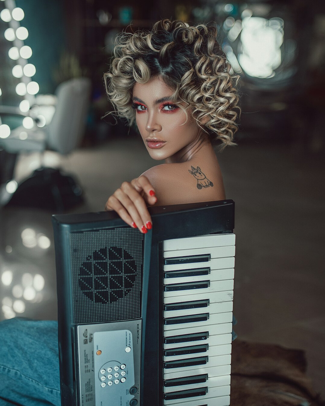 Studio portrait of a woman sound engineer with curly hair