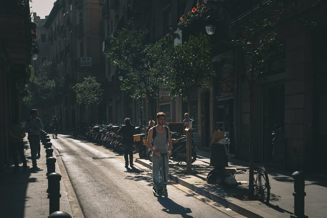 Small film crew filming outdoors in a European city street